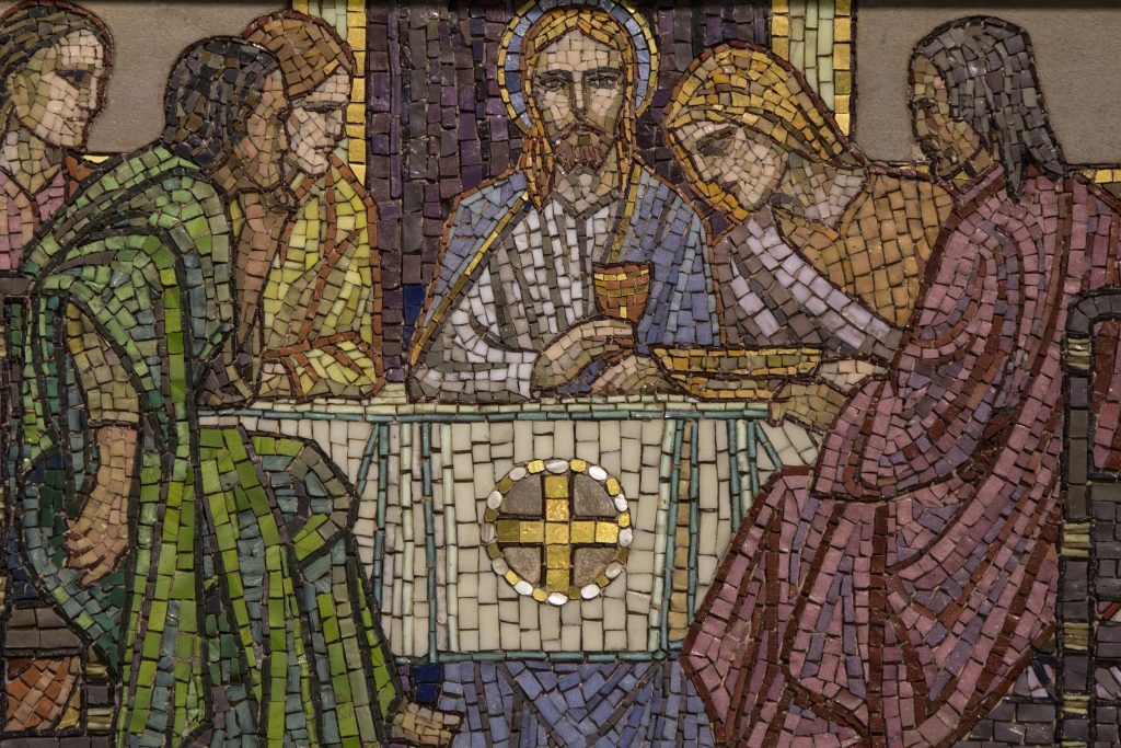 A mosaic of Christ with a plate and cup, depicting the institution of the Eucharist or Lord's Supper.